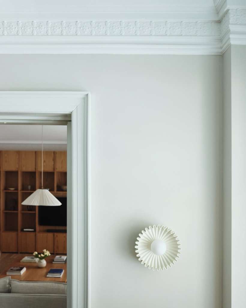 Plaster, molding, and a pleated sconce