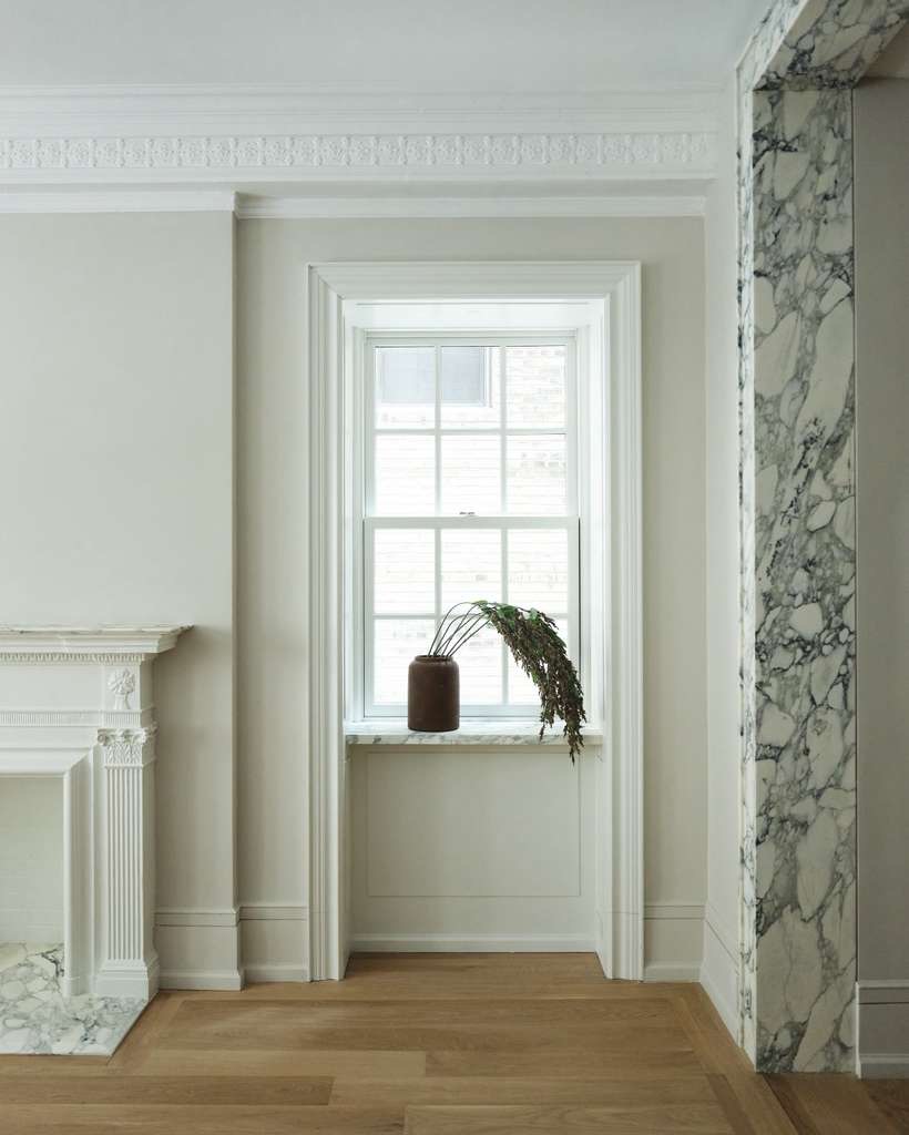Living room with the original marble fireplace